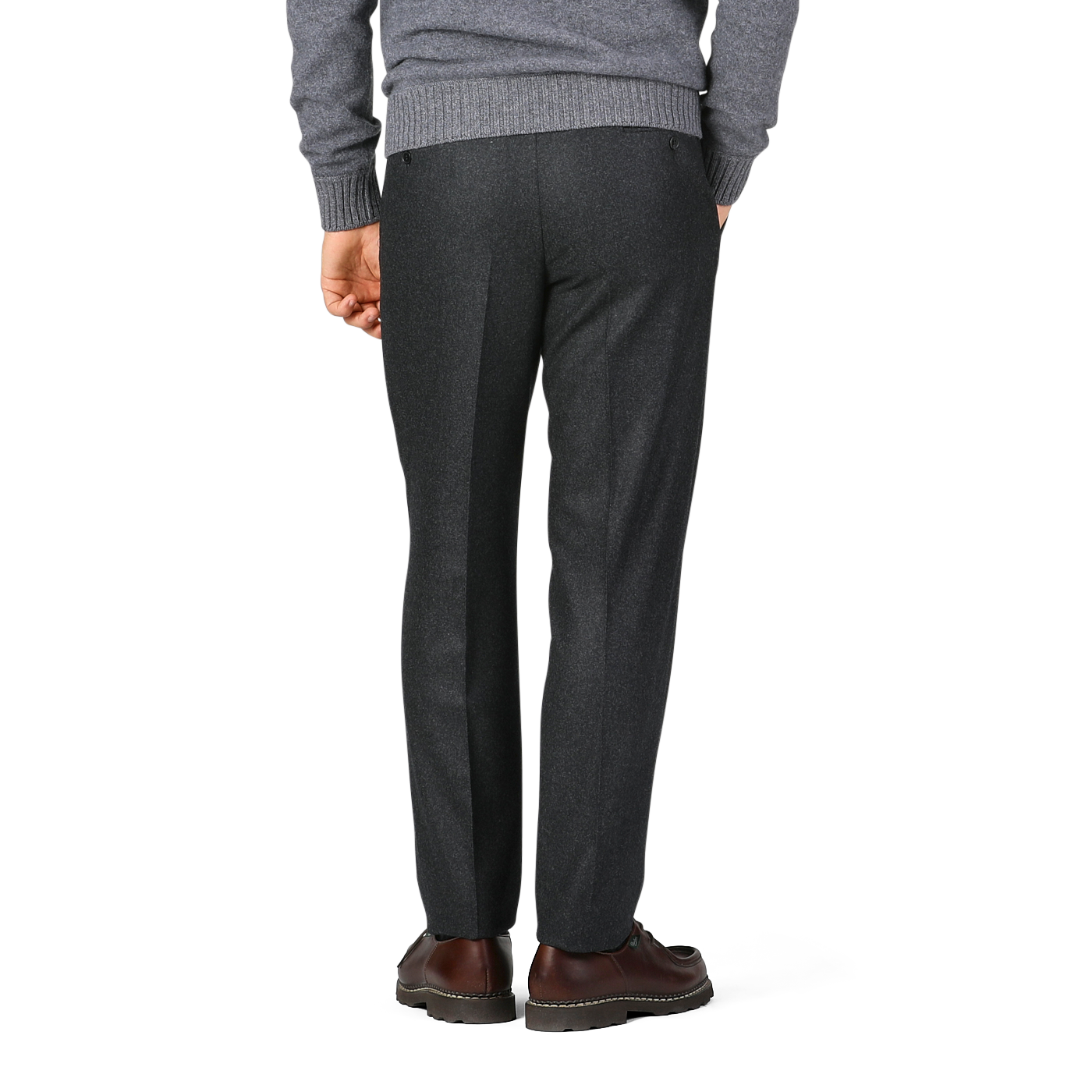 Back view of a person wearing Luigi Bianchi Charcoal Grey Wool Flannel Flat Front Trousers, a gray sweater, and brown dress shoes.