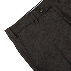 Close-up image of a pair of Dark Brown Wool Flannel Flat Front Trousers by Luigi Bianchi, showing the waistband, belt loops, button, and part of a pocket.