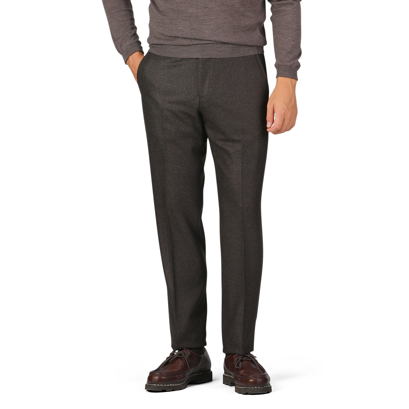 A person is wearing a long-sleeved grey sweater, dark brown wool flannel flat front trousers from Luigi Bianchi, and brown dress shoes. Hands are in the pockets of the trousers; the head is not visible in the image.