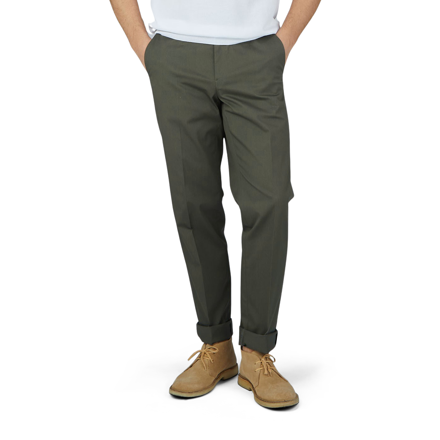 A man in Luigi Bianchi dark green cotton twill flat front trousers and a white t-shirt.