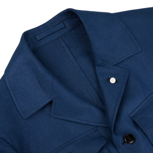 A close up of a Luigi Bianchi Indigo Blue Linen Twill Field Jacket.