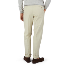 This is a man wearing Light Beige Cotton Twill Flat Front Trousers in a regular fit by Luigi Bianchi.