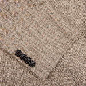 A close up of a Light Brown Herringbone Linen Suit made by Luigi Bianchi with buttons.