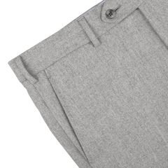 Close-up of the Light Grey Wool Flannel Flat Front Trousers by Luigi Bianchi, highlighting the waistband, belt loop, and a single button closure.