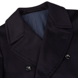 A close up of a Luigi Bianchi Navy Blue Wool Cashmere Dream Polo Coat.