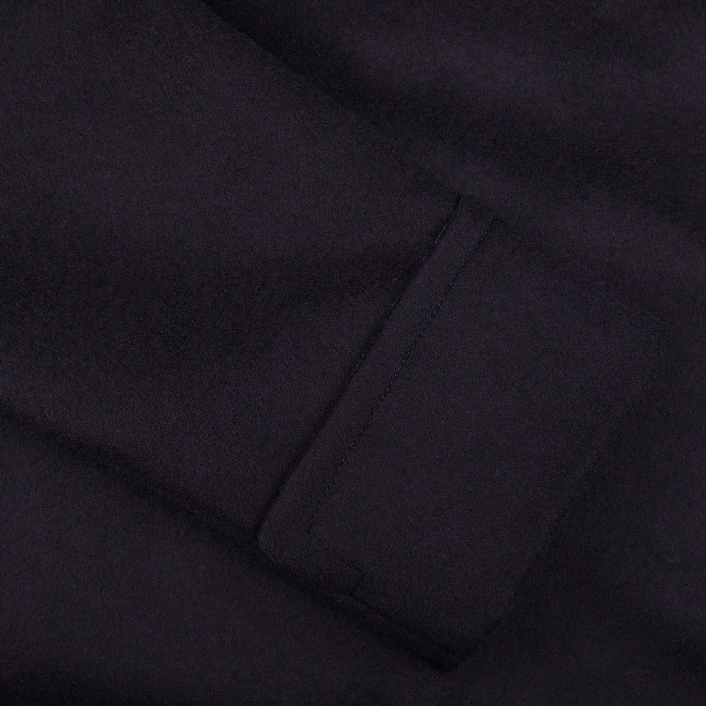 A black shirt with a pocket featuring Luigi Bianchi's Navy Blue Wool Cashmere Dream Polo Coat.