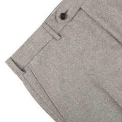 Close-up of a pair of Luigi Bianchi Oatmeal Beige Wool Flannel Flat Front Trousers showing the waistband, button, and part of the front pockets. The fabric, made from Vitale Barberis wool flannel, has a slightly textured appearance.