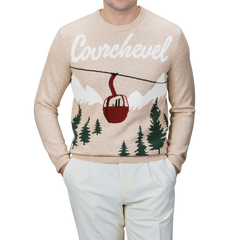 An individual is dressed in a beige sweater from MC2 Saint Barth, specifically the Beige Wool Cashmere Courchevel Sweater featuring "Courchevel" and a ski lift design, complemented by white pants.