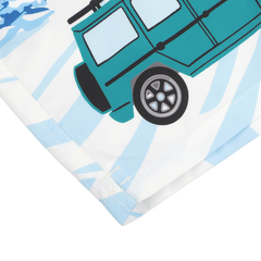 Close-up of the Blue St. Moritz Printed Swim Shorts by MC2 Saint Barth, showcasing a blue-green jeep illustration with bold outlines and a stylized design on quick-drying fabric. The background features light blue and white patterns evoking the serene ambiance of St. Moritz.