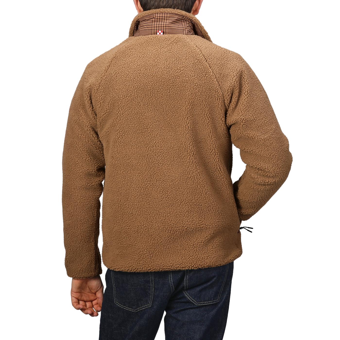 A person is seen from the back, wearing an MC2 Saint Barth Camel Beige Sherpa Fleece Jacket paired with blue jeans, set against a plain background.