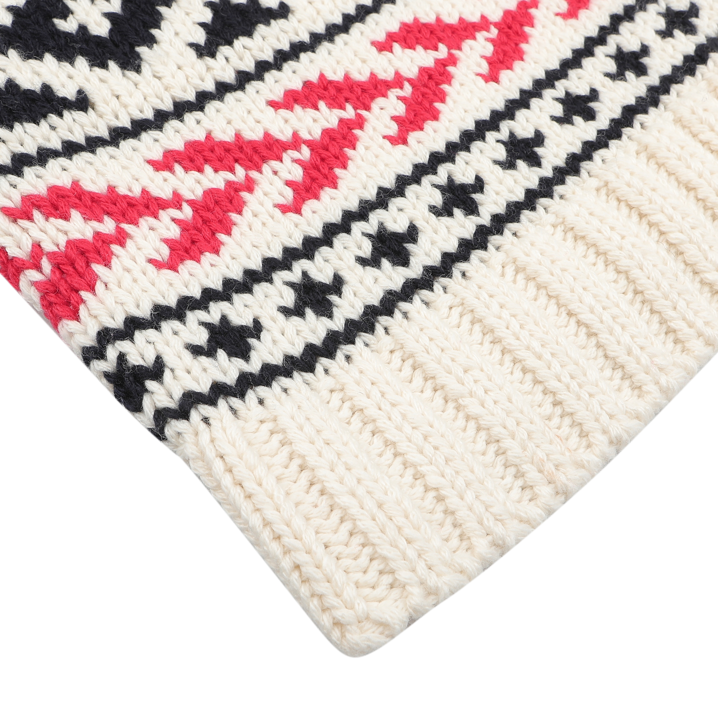 A close-up of a cream wool-blend fabric showcasing red and black geometric shapes on a white background, complete with a ribbed edge, reminiscent of the Cream White Wool Nordic Aztec Cardigan by MC2 Saint Barth.