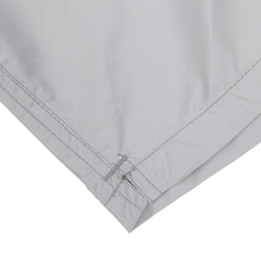 The image highlights the corner of MC2 Saint Barth's Light Grey Pantone 15-4307 Swim Shorts, showcasing the visible stitching and folded hem made from quick-drying fabric, all set against a white background.