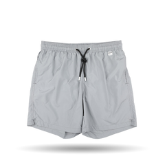 Introducing the Light Grey Pantone 15-4307 Swim Shorts from MC2 Saint Barth, crafted with quick-drying fabric and featuring convenient pockets set against a crisp white background. Ideal for anyone seeking style and functionality in their swimwear.