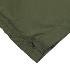 The MC2 Saint Barth Military Green Pantone 18-0316 Swim Shorts showcase precise stitching and a folded edge, made from quick-drying fabric for lasting comfort. The look is finished with a stylish contrasting drawstring waist.