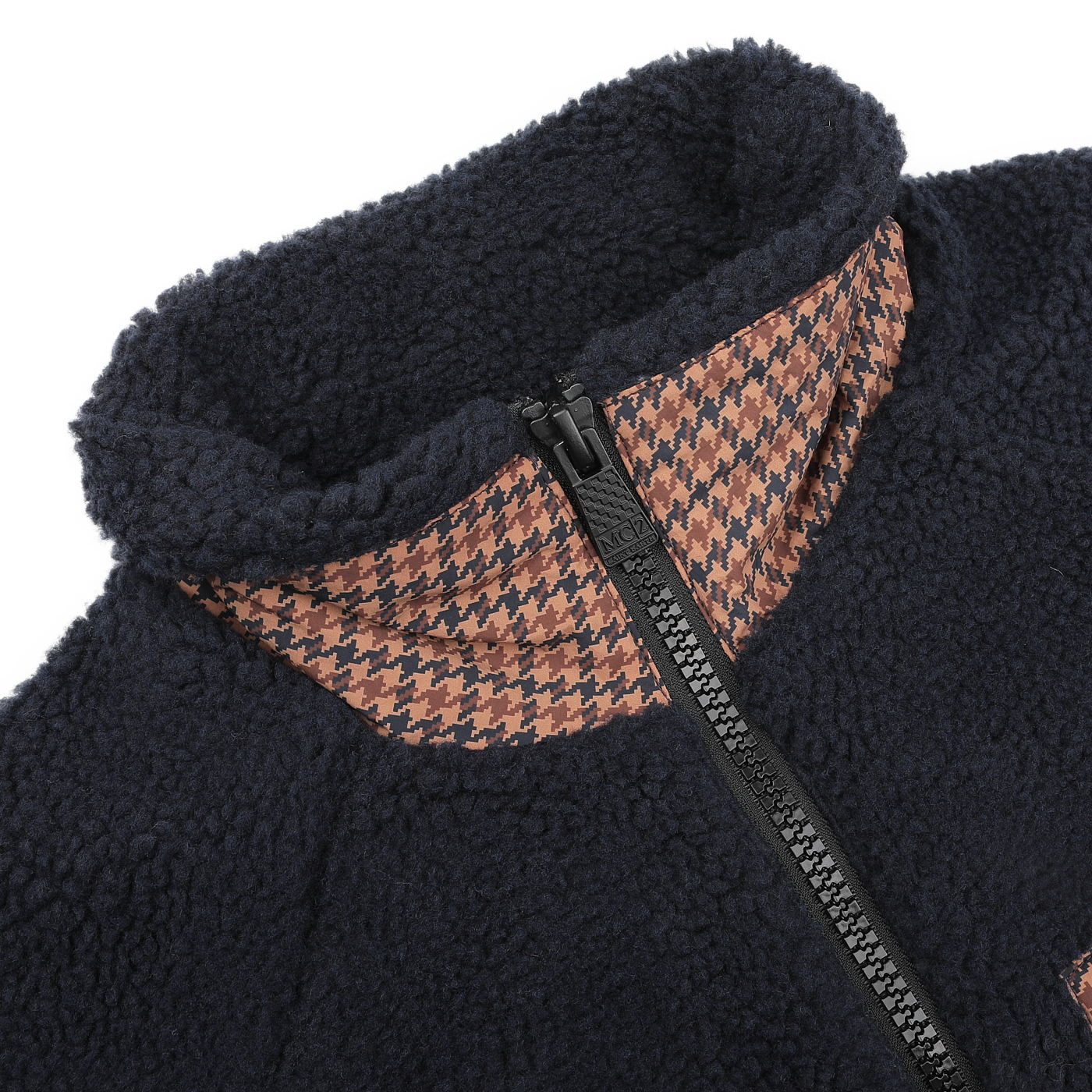 A detailed view of the MC2 Saint Barth Navy Blue Sherpa Fleece Jacket showcases its front zip-up design. The regular fit is highlighted by a unique collar featuring a camel beige and black houndstooth pattern.