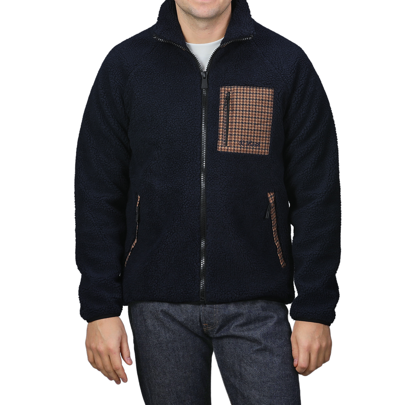 A man wearing the MC2 Saint Barth Navy Blue Sherpa Fleece Jacket showcases a zip-up front, complemented by a camel beige houndstooth patterned chest pocket and matching side pockets.