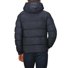 A person wearing an MC2 Saint Barth Navy Blue Technical Padded Maier Jacket, viewed from the back.