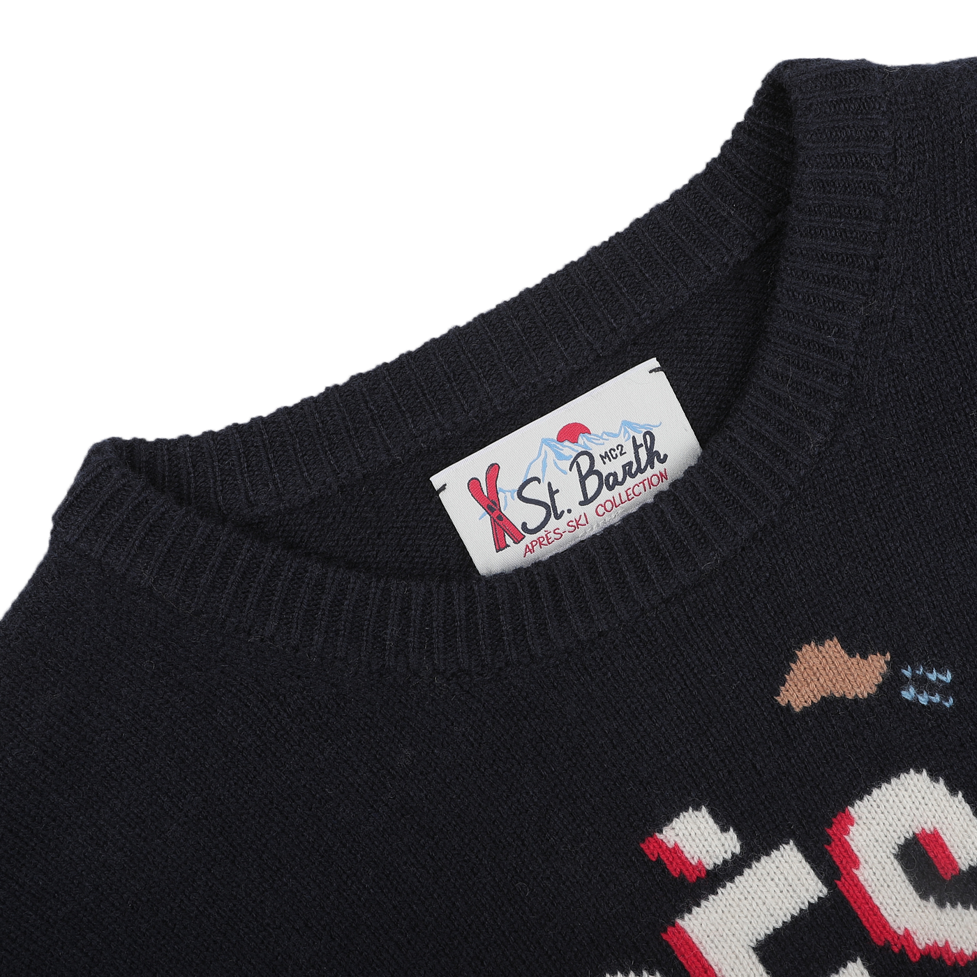 Close-up of a navy blue wool cashmere sweater highlighting the "MC2 Saint Barth" label at the neckline, ideal for cozy evenings at ski resorts.