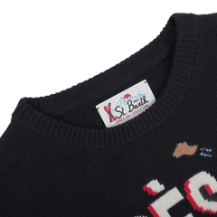 Close-up of a navy blue wool cashmere sweater highlighting the "MC2 Saint Barth" label at the neckline, ideal for cozy evenings at ski resorts.