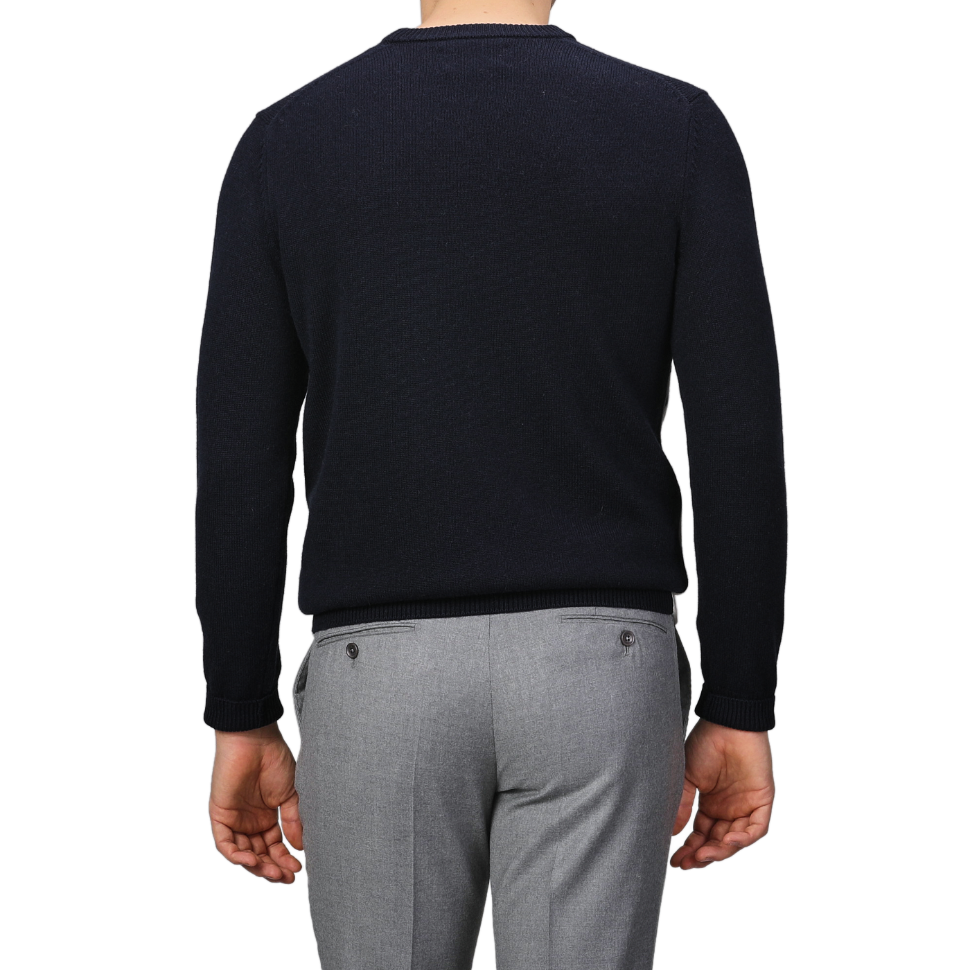 A person is wearing a Navy Blue Wool Cashmere Courchevel Sweater from MC2 Saint Barth and gray pants, facing away from the camera with their arms relaxed by their sides.