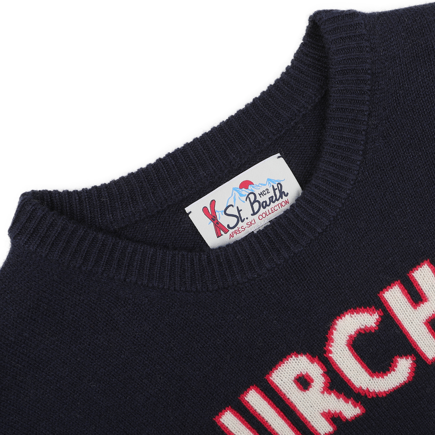 A close-up of the Navy Blue Wool Cashmere Courchevel Sweater from MC2 Saint Barth features red and white text on the front. The collar showcases the "St. Barth" label, infusing your winter wardrobe with a hint of Courchevel chic.