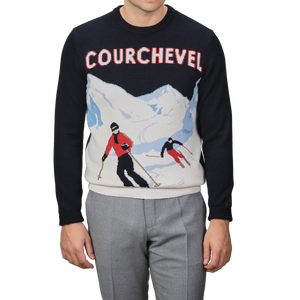 Someone is seen wearing the Navy Blue Wool Cashmere Courchevel Sweater from MC2 Saint Barth, showcasing a vibrant skiing scene and prominently featuring "Courchevel," in honor of one of the most famous ski resorts.