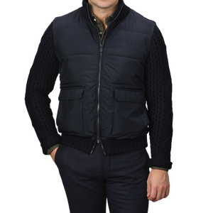 A person wearing a Navy Blue Wool Whistler Padded Jacket by MC2 Saint Barth, paired with dark trousers, stands against a plain background.