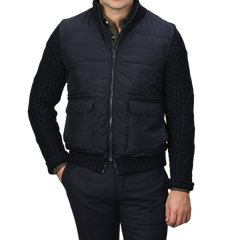 A person wearing a Navy Blue Wool Whistler Padded Jacket by MC2 Saint Barth, paired with dark trousers, stands against a plain background.