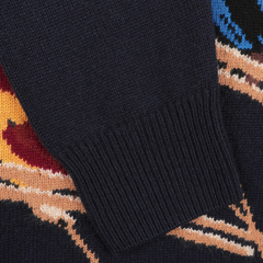 Close-up of a dark-colored sleeve on the Navy Wool Cashmere Cortina Sweater by MC2 Saint Barth, highlighting the vibrant pattern and texture that evoke the chic elegance of Cortina, Italy.