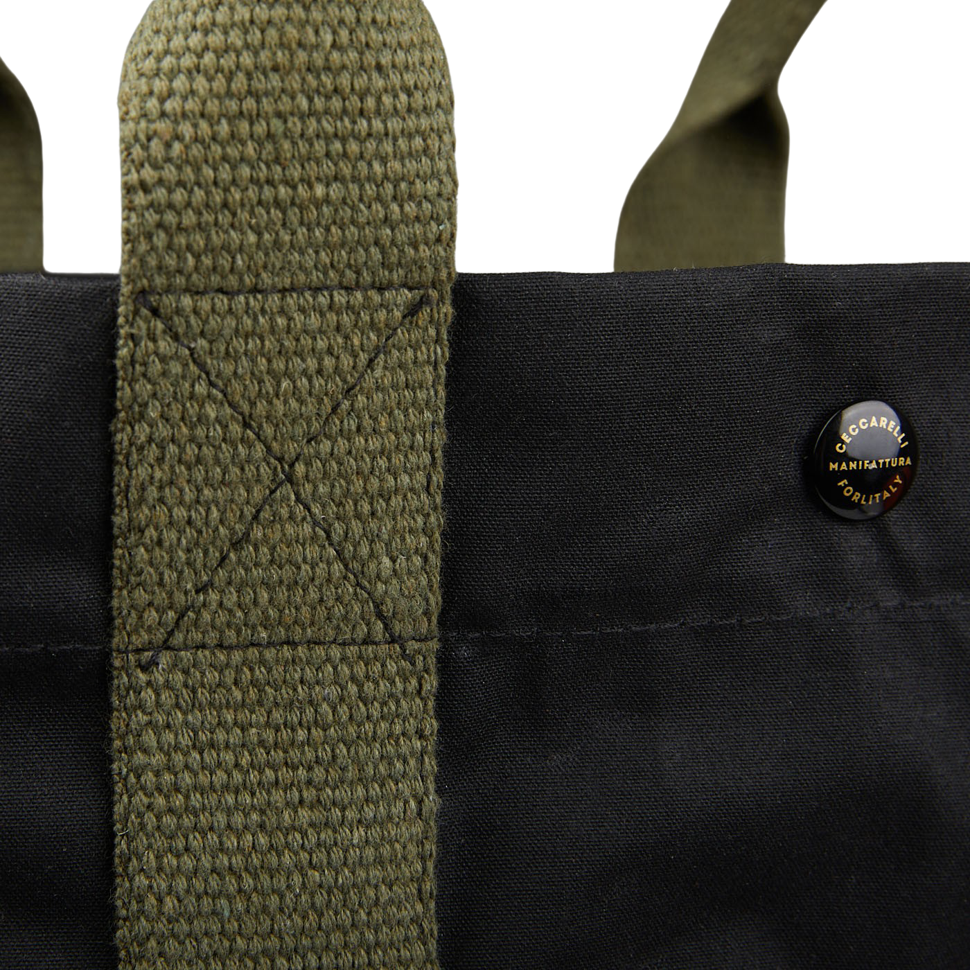 A close up of a Manifattura Ceccarelli Black Waxed Cotton Tote Bag with canvas details in a dark green shade.