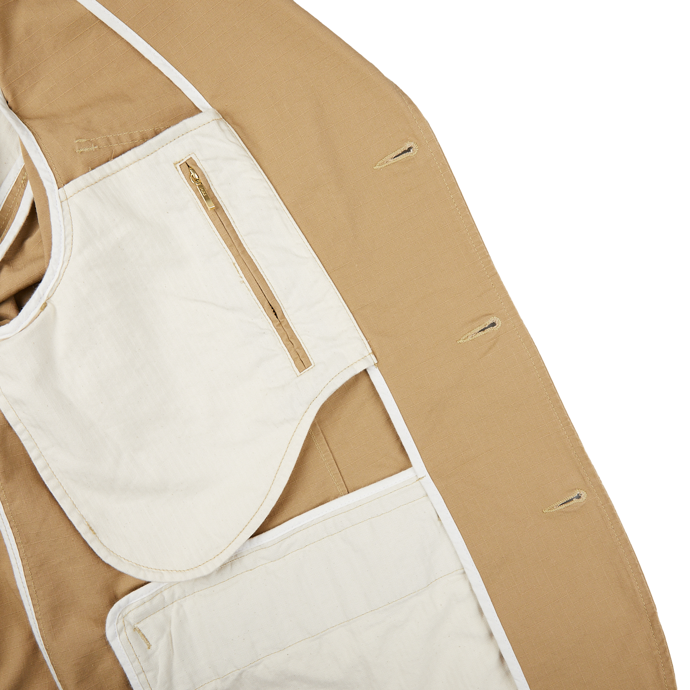 The back of a tan Manifattura Ceccarelli Camel Beige Ripstop Cotton Bush Jacket with white pockets.