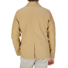 The back view of a man wearing a Manifattura Ceccarelli Camel Beige Ripstop Cotton Bush Jacket.