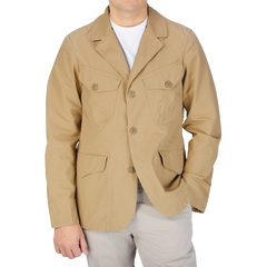 The man is wearing a Camel Beige Ripstop Cotton Bush Jacket made by Manifattura Ceccarelli.