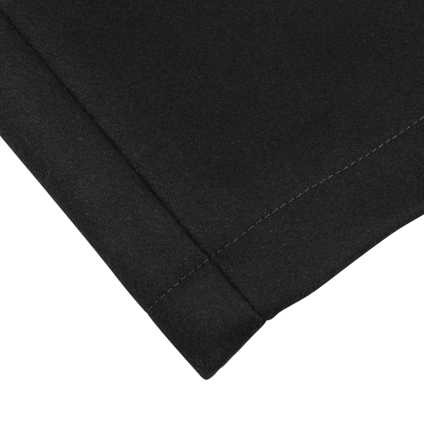 Close-up of a black fabric corner with neat stitching along the edges, reminiscent of the detailed craftsmanship seen in a Manifattura Ceccarelli Dark Navy Heavy Wool Peacoat.