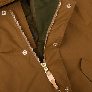 A close up of a Dark Tan Cotton Canvas Fisherman Parka jacket with zippers, made in Italy by Manifattura Ceccarelli.