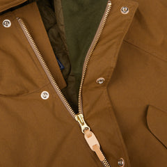 A close up of a Dark Tan Cotton Canvas Fisherman Parka jacket with zippers, made in Italy by Manifattura Ceccarelli.