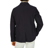 The back view of a man wearing a Manifattura Ceccarelli Navy Blue Ripstop Cotton Bush Jacket.