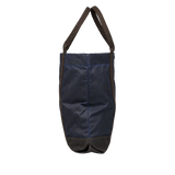 A Navy Blue Waxed Cotton Tote Bag with brown handles by Manifattura Ceccarelli.