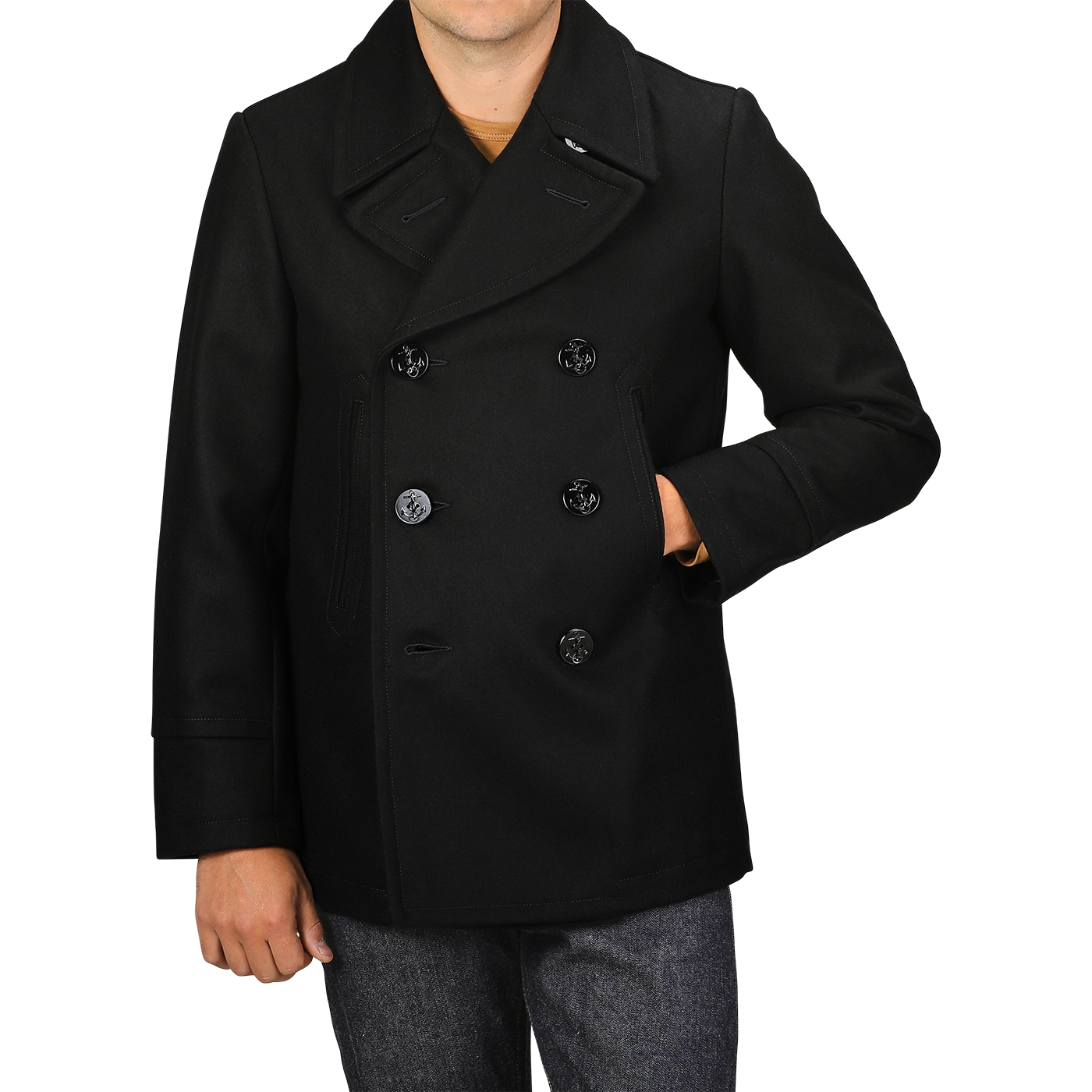 A person in a Manifattura Ceccarelli Dark Navy Heavy Wool Peacoat stands with their right hand in the coat pocket while their left hand rests relaxed by their side. Only the upper body is visible in the image.