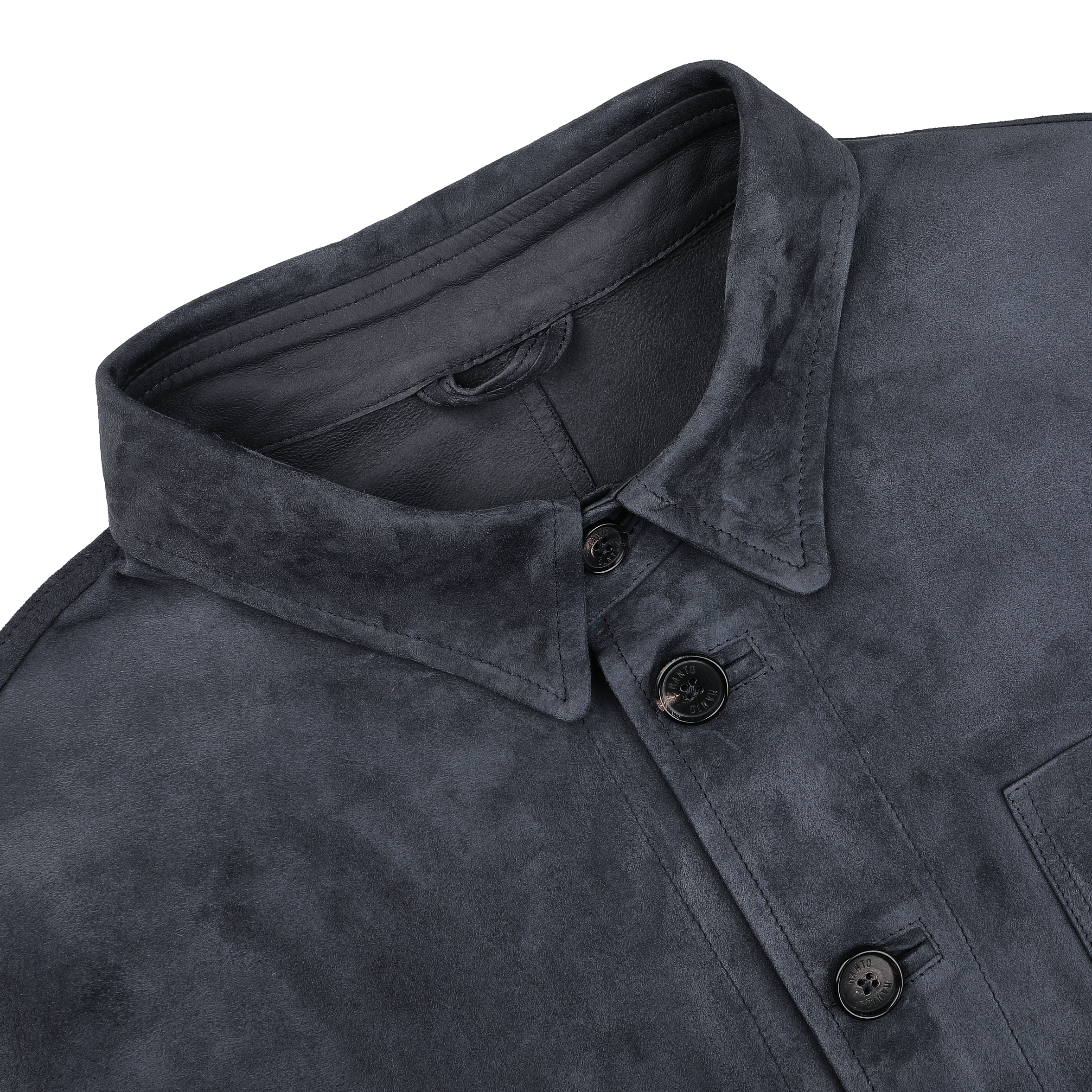 Close-up of the Manto Denim Blue Suede Unlined Jacket featuring a collared design with four black buttons and a visible chest pocket.