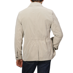 A person is shown from the back in a Manto Khaki Beige Ultrafine Microfibre Safari Jacket and dark jeans against a neutral background.