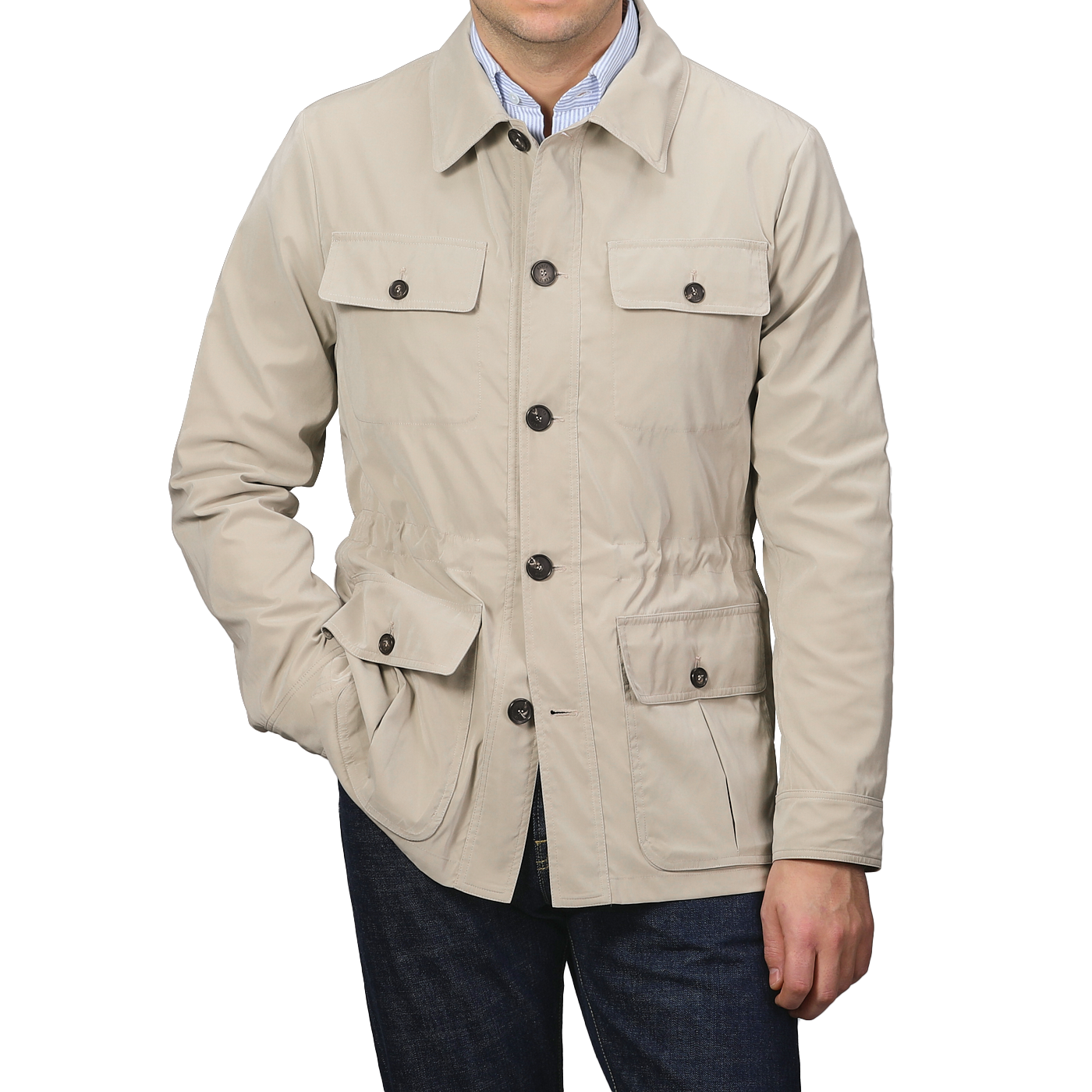 A person wearing a Manto Khaki Beige Ultrafine Microfibre Safari Jacket with button closures and multiple pockets, paired with dark jeans.