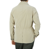 The slim fit man wearing a Manto Khaki Beige Ultrafine Microfiber Safari Jacket.