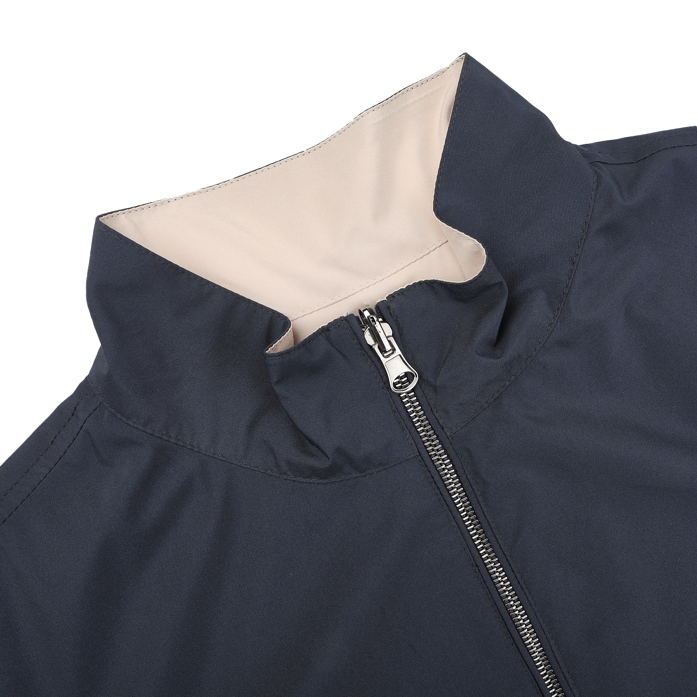 Close-up of Manto's Navy Beige Reversible Nylon Blouson, showcasing a navy exterior and light beige inner lining. It features a silver full-length zipper, standing collar, and is crafted from water-resistant nylon.