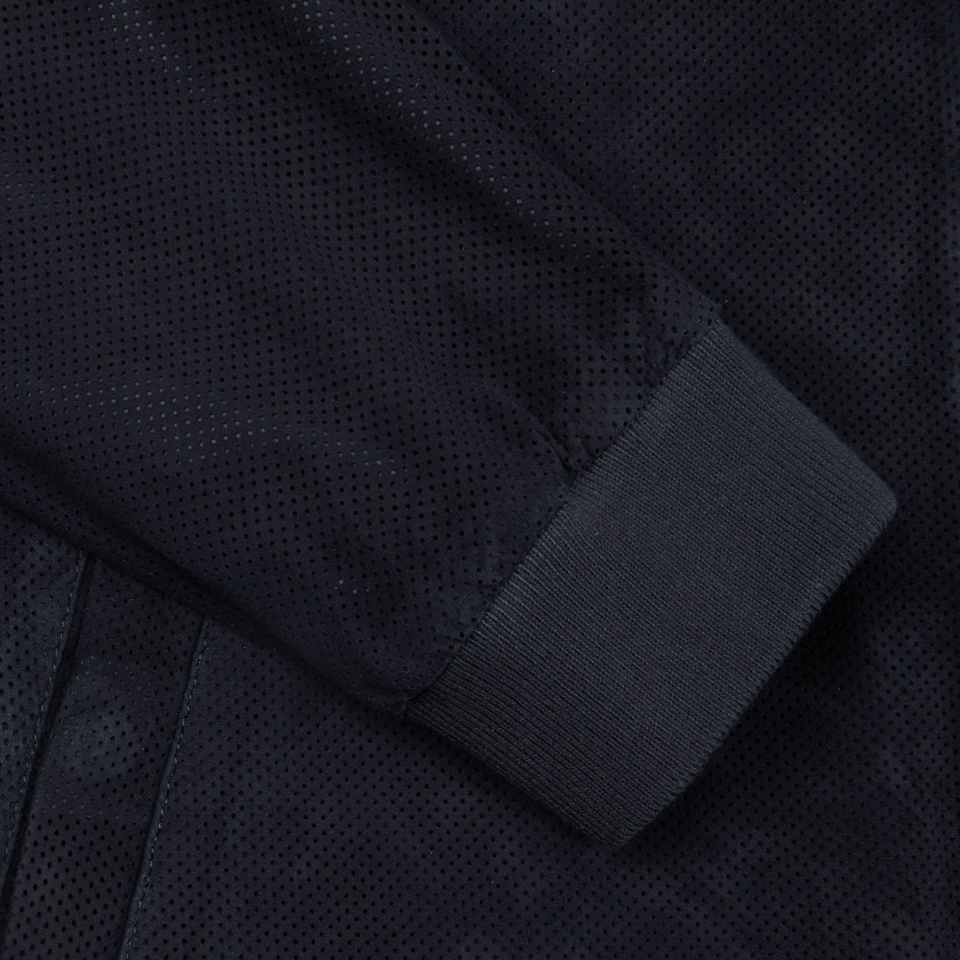 A close up of a Manto navy blue perforated suede leather blouson.