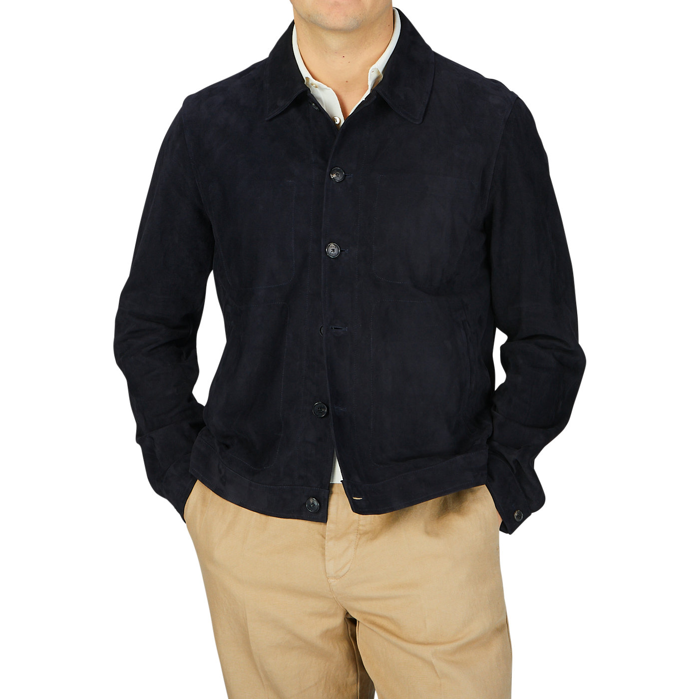 A man wearing a Manto navy blue suede leather overshirt and tan pants.