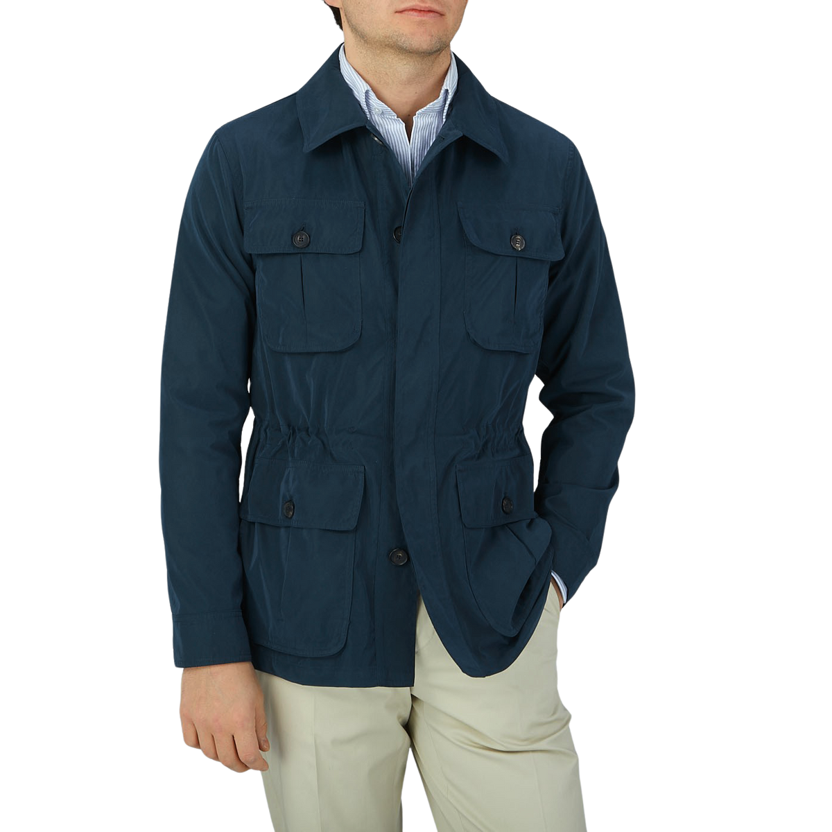 A man wearing a Manto Navy Blue Ultrafine Microfiber Safari Jacket and tan pants.