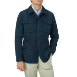 A man wearing a Manto Navy Blue Ultrafine Microfiber Safari Jacket and tan pants.