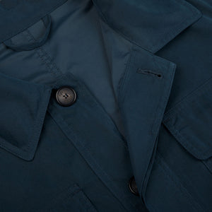 A close up of a Manto Navy Blue Ultrafine Microfiber Safari Jacket with buttons.