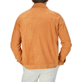 The back view of a man wearing a Manto Bright Tan Suede Leather Overshirt.